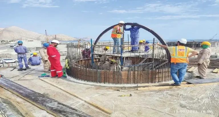 Crew fixing steel reinforcement for a circular foundation
