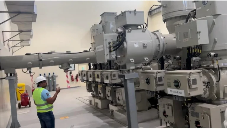 Engineer inspecting gas-insulated switchgear at Exahertz Technology Park Phase 3